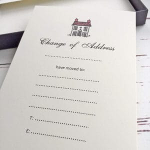 A change of address card with a red roof illustration
