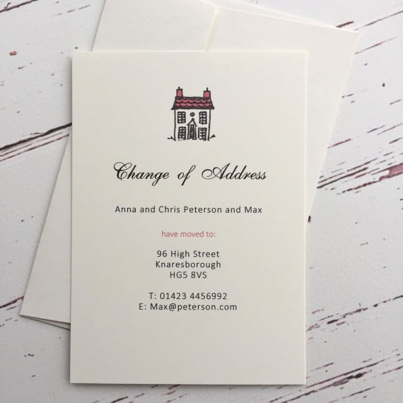 A change of address card with a red roof illustration