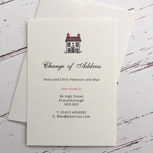 A change of address card with a red roof illustration