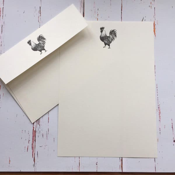 A cockerel illustration on writing paper with matching envelope